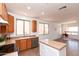 Bright kitchen featuring stainless steel appliances, an island, and an open floorplan at 2527 E Remington Pl, Chandler, AZ 85286