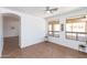Bright living room featuring tile flooring, neutral walls, and large windows at 2527 E Remington Pl, Chandler, AZ 85286