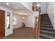 Bright living room with tile flooring, a staircase, and ample natural light at 2527 E Remington Pl, Chandler, AZ 85286