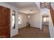 Bright living room with tile flooring, a staircase, and ample natural light at 2527 E Remington Pl, Chandler, AZ 85286
