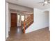 Bright living room featuring tile flooring, neutral walls, and a staircase at 2527 E Remington Pl, Chandler, AZ 85286