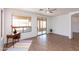 Bright living room featuring sliding glass door, tile flooring, and modern ceiling fan at 2527 E Remington Pl, Chandler, AZ 85286