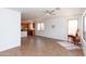 Open concept living room filled with natural light, ceiling fan, and neutral color palette at 2527 E Remington Pl, Chandler, AZ 85286