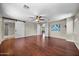 Expansive bedroom with hardwood flooring, ceiling fan, and multiple doorways for easy access at 2541 E Carob Dr, Gilbert, AZ 85298