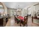 Elegant dining room features a long wooden table and beautiful natural light at 2541 E Carob Dr, Gilbert, AZ 85298