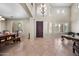 Bright entryway boasting high ceilings, tile flooring, and elegant chandelier lighting fixture at 2541 E Carob Dr, Gilbert, AZ 85298