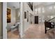 Welcoming foyer with soaring ceilings, tile floors, and an elegant chandelier at 2541 E Carob Dr, Gilbert, AZ 85298