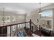 Grand foyer with high ceilings, clerestory windows, and dark wood railing overlooking the living space at 2541 E Carob Dr, Gilbert, AZ 85298
