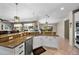 Bright kitchen with wraparound counters, granite countertops, and stainless steel dishwasher at 2541 E Carob Dr, Gilbert, AZ 85298