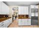 Bright kitchen boasts granite countertops, stainless appliances, and ample cabinet space at 2541 E Carob Dr, Gilbert, AZ 85298