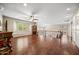 Spacious living room with hardwood floors and ceiling fan at 2541 E Carob Dr, Gilbert, AZ 85298