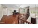 Spacious living room with hardwood floors, ceiling fan and large window with a backyard view at 2541 E Carob Dr, Gilbert, AZ 85298