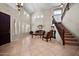 Spacious living room with tall ceilings, clerestory windows, and staircase at 2541 E Carob Dr, Gilbert, AZ 85298