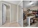 Walk-in closet with organized shelves, clothing racks, and access to an adjacent bathroom at 2541 E Carob Dr, Gilbert, AZ 85298