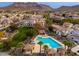 Aerial view of a community pool surrounded by houses and mountain backdrop at 26505 N Babbling Brook Dr, Phoenix, AZ 85083