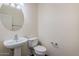 Elegant powder room with pedestal sink and modern fixtures at 26505 N Babbling Brook Dr, Phoenix, AZ 85083