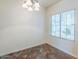 Well-lit dining area features stylish light fixture and window with modern blinds at 26505 N Babbling Brook Dr, Phoenix, AZ 85083