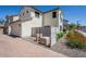 Exterior view of house with well maintained desert landscaping, attached garage and brick driveway at 26505 N Babbling Brook Dr, Phoenix, AZ 85083
