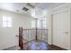 Upstairs hallway with tile flooring, decorative railing, and access to multiple rooms at 26505 N Babbling Brook Dr, Phoenix, AZ 85083