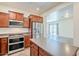Updated kitchen featuring stainless steel appliances, wood cabinets, and a center island at 26505 N Babbling Brook Dr, Phoenix, AZ 85083