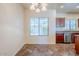 Eat-in kitchen featuring window views, stainless steel appliances, and wood cabinetry at 26505 N Babbling Brook Dr, Phoenix, AZ 85083