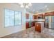 Eat-in kitchen featuring wood cabinets, stainless steel appliances, and tile flooring at 26505 N Babbling Brook Dr, Phoenix, AZ 85083