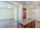 Open-concept kitchen and dining area with stainless steel appliances and tiled floors at 26505 N Babbling Brook Dr, Phoenix, AZ 85083