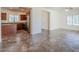 Open-concept living area with tile flooring, neutral walls, and ample natural light from the windows at 26505 N Babbling Brook Dr, Phoenix, AZ 85083