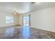 Well-lit living space showcasing tile floors, ceiling fan, neutral paint and window with blinds at 26505 N Babbling Brook Dr, Phoenix, AZ 85083