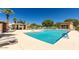 Community pool with lounge chairs and shaded areas, perfect for relaxing at 26505 N Babbling Brook Dr, Phoenix, AZ 85083