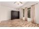 A bedroom with laminate floors, closet with 4 doors, neutral walls and a ceiling fan at 2741 E San Tan St, Chandler, AZ 85225