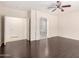 Main bedroom with laminate flooring, ceiling fan and access to bathroom with stylish tiled shower at 2741 E San Tan St, Chandler, AZ 85225
