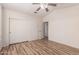 Neutral bedroom with wood-look flooring, closet and fan for ultimate comfort and convenience at 2741 E San Tan St, Chandler, AZ 85225