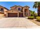 Two story home with a large driveway, three car garage, and desert landscaping at 2741 E San Tan St, Chandler, AZ 85225