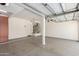 Spacious garage with epoxy flooring and ample storage space for vehicles and tools at 2741 E San Tan St, Chandler, AZ 85225