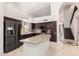 A spacious kitchen with brown cabinets, granite countertops, stainless steel appliances and a center island at 2741 E San Tan St, Chandler, AZ 85225