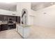 Open concept kitchen with stainless steel appliances and a kitchen island at 2741 E San Tan St, Chandler, AZ 85225