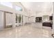 Bright open living room with soaring ceilings, sliding glass doors and tile flooring at 2741 E San Tan St, Chandler, AZ 85225