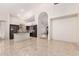 Bright open living room leading into the kitchen, featuring soaring ceilings and tile floors at 2741 E San Tan St, Chandler, AZ 85225
