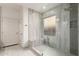 Walk-in shower featuring seamless glass, built-in bench, and modern tile work for a spa-like experience at 2741 E San Tan St, Chandler, AZ 85225