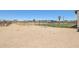 Expansive backyard featuring play equipment and offers ample space for recreation at 28156 N Edwards Rd, San Tan Valley, AZ 85143