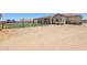 View of the backyard featuring play equipment and the exterior of the home at 28156 N Edwards Rd, San Tan Valley, AZ 85143