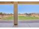 Covered patio offers views of the expansive backyard with a playground at 28156 N Edwards Rd, San Tan Valley, AZ 85143