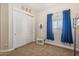 Bedroom features a closet with sliding doors and a window with blue curtains at 28156 N Edwards Rd, San Tan Valley, AZ 85143