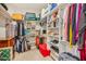 Spacious walk-in closet with custom shelving and ample storage for clothes and accessories at 28156 N Edwards Rd, San Tan Valley, AZ 85143