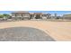 Well-maintained single-story home with neutral paint, rock accents, and desert landscaping at 28156 N Edwards Rd, San Tan Valley, AZ 85143