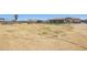 Large horse property with riding arena, home in background, and ample space for equestrian activities at 28156 N Edwards Rd, San Tan Valley, AZ 85143