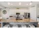 Well-lit kitchen with large island, bar stool seating, and stainless steel appliances at 28156 N Edwards Rd, San Tan Valley, AZ 85143