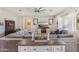 Bright living room featuring hardwood floors, neutral colors, and comfortable furnishings at 28156 N Edwards Rd, San Tan Valley, AZ 85143