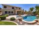 Backyard oasis featuring a sparkling pool, patio area, and lush landscaping at 28806 N 23Rd Ln, Phoenix, AZ 85085